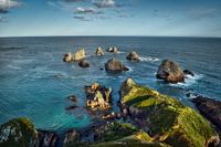 Sea view with rocks at Nugget Point. Coastal landscape at Nugget Point, New Zealand. Rocky coast and ocean panorama at Nugget Point, Natural wonder at Nugget Point, Coastal idyll with rock formations,