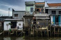 Stalk houses with colorful colors at the river Menkong